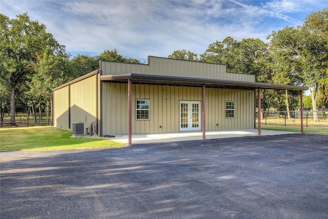4676 County Road 2230, Caddo Mills, TX 75135 - view of outbuilding featuring french doors and central AC unit