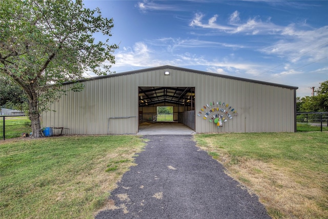 view of outbuilding with a lawn