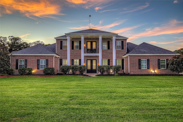 4676 County Road 2230, Caddo Mills, TX 75135 - neoclassical / greek revival house with brick siding, french doors, a lawn, and a shingled roof