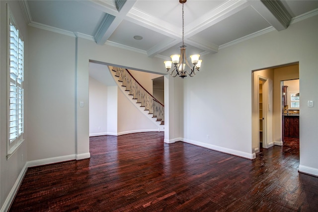 empty room featuring beamed ceiling, coffered ceiling, dark wood-type flooring, and a chandelier