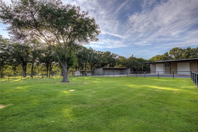 4676 County Road 2230, Caddo Mills, TX 75135 - view of yard featuring a detached garage and view of wooded area