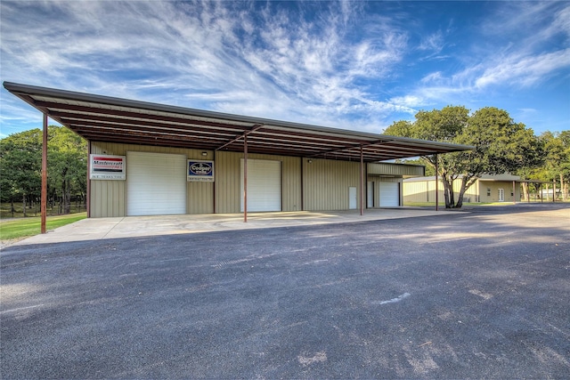 garage featuring a carport