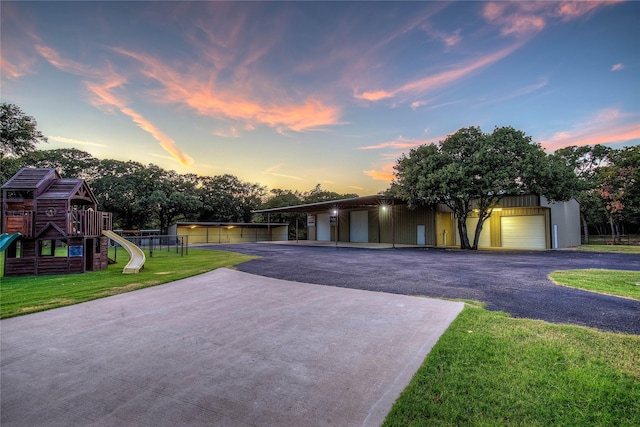 4676 County Road 2230, Caddo Mills, TX 75135 - view of front of home featuring a lawn, a playground, and a garage