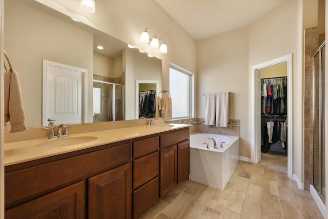 bathroom with plus walk in shower and vanity