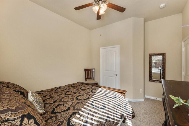 bedroom with ceiling fan and carpet floors