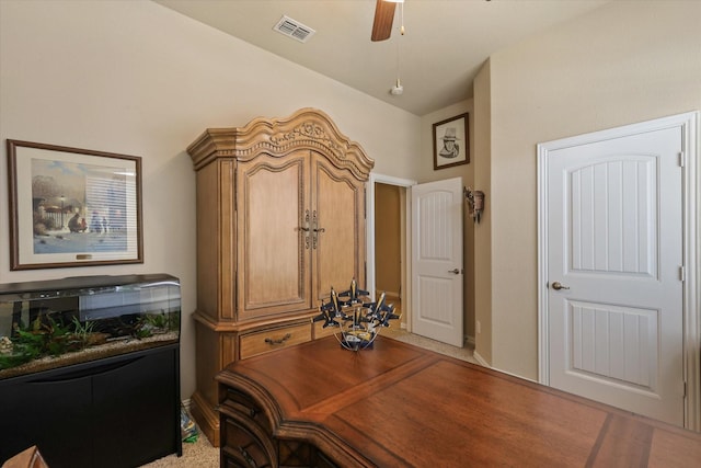 home office featuring carpet flooring, ceiling fan, and lofted ceiling