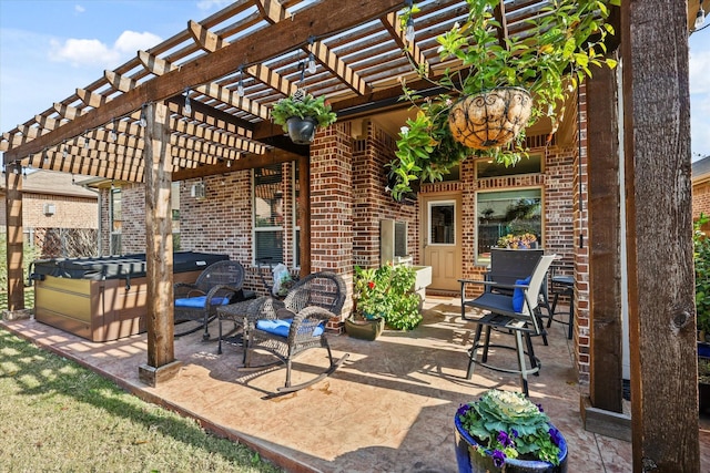 view of patio / terrace with a pergola and a hot tub