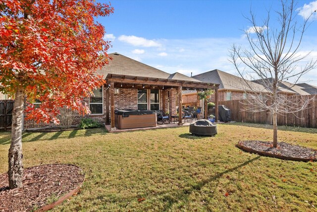 rear view of property with a pergola, a yard, and a hot tub