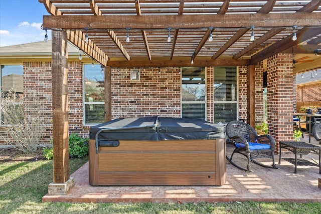 view of patio with a pergola and a hot tub