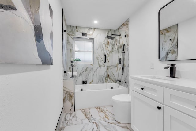 full bathroom featuring vanity, toilet, and tiled shower / bath