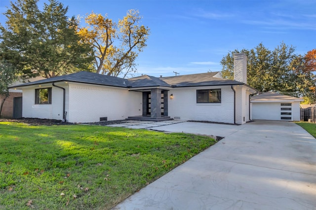 ranch-style house with a front lawn and a garage