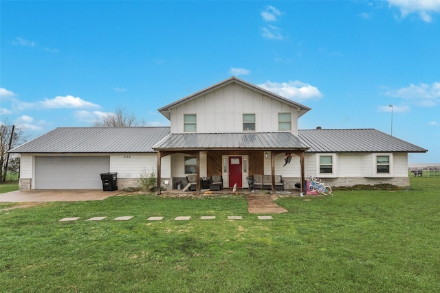 view of front of house with a garage, a front yard, and a porch