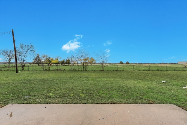 view of yard with a rural view