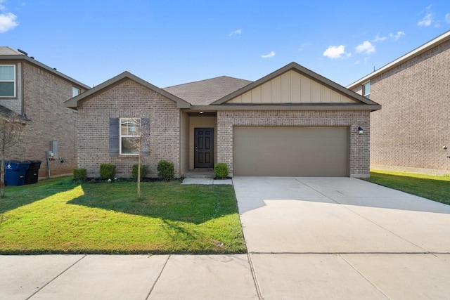 view of front of property with a front yard and a garage