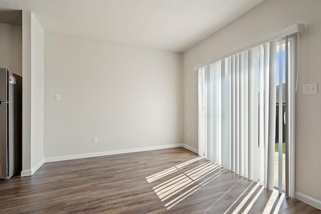 unfurnished room featuring dark hardwood / wood-style flooring