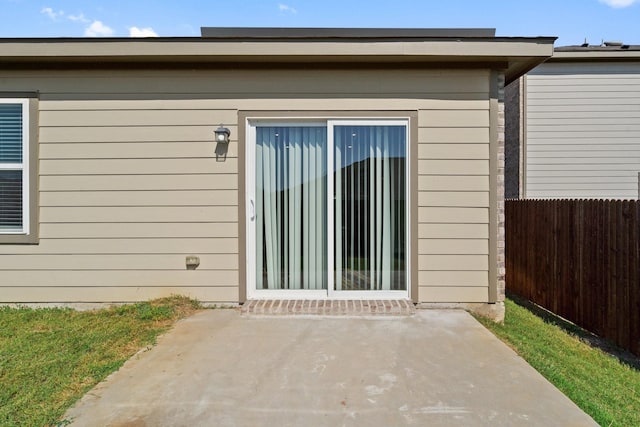 doorway to property featuring a patio