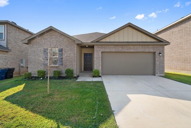 view of front of property with a garage and a front lawn