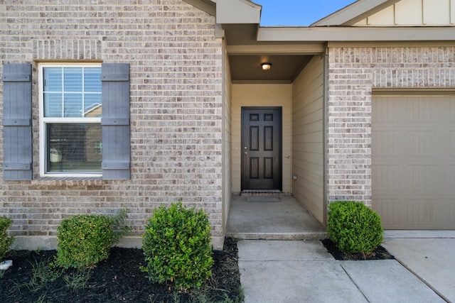 entrance to property featuring a garage