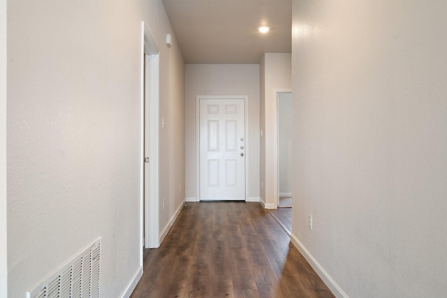 hall with dark hardwood / wood-style flooring