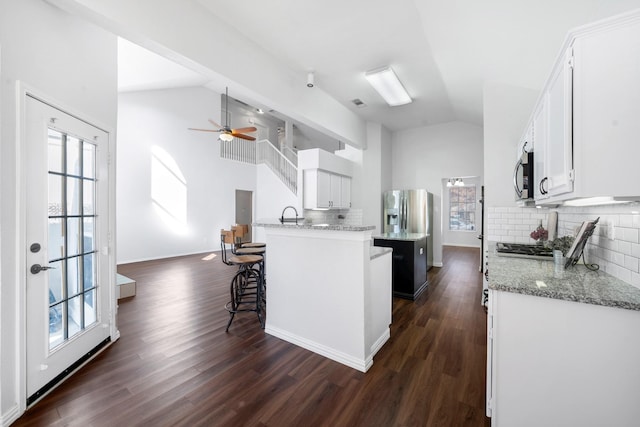 kitchen with white cabinetry and a healthy amount of sunlight