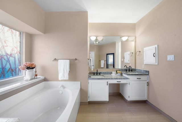 bathroom with vanity and a bathing tub