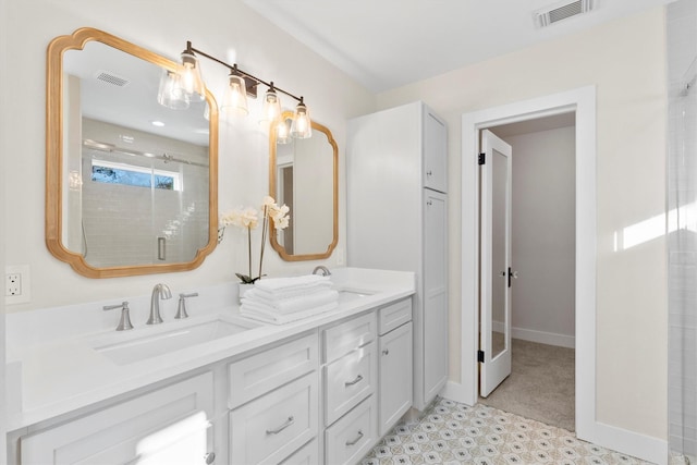 bathroom featuring vanity and a shower with shower door