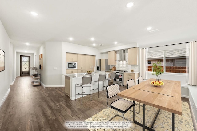 dining room with baseboards, recessed lighting, and dark wood-style floors