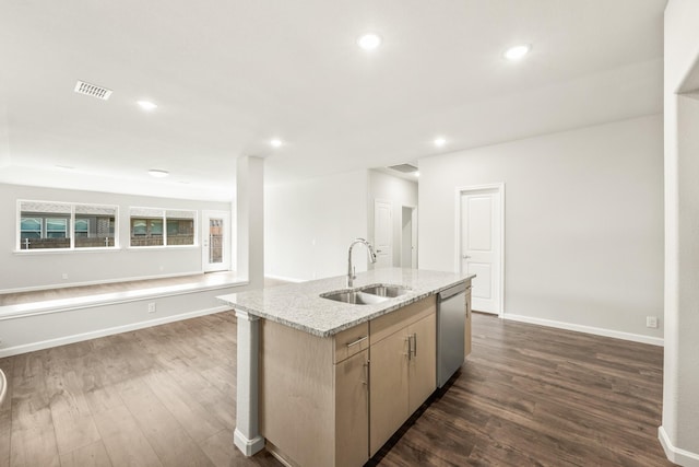 kitchen featuring stainless steel dishwasher, dark wood finished floors, visible vents, a sink, and open floor plan