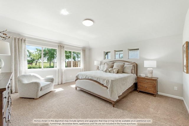 bedroom featuring light carpet