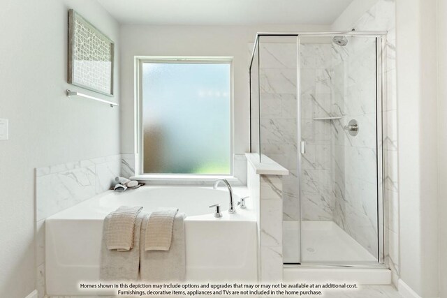 bathroom with plus walk in shower and a wealth of natural light