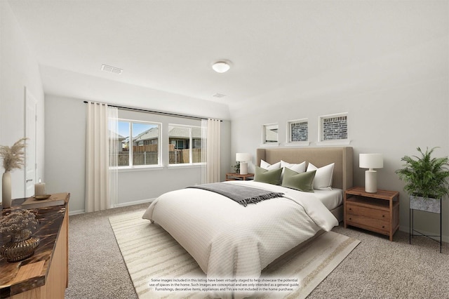 bedroom featuring visible vents, carpet flooring, and baseboards