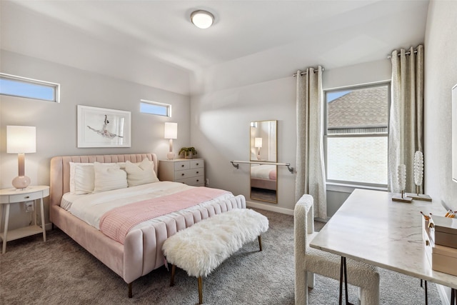 carpeted bedroom featuring multiple windows