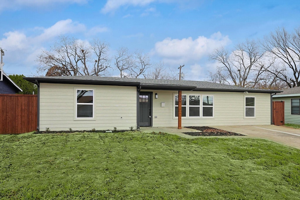 ranch-style house with a front lawn