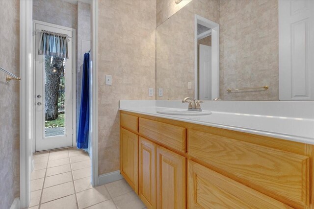 bathroom with tile patterned floors and vanity