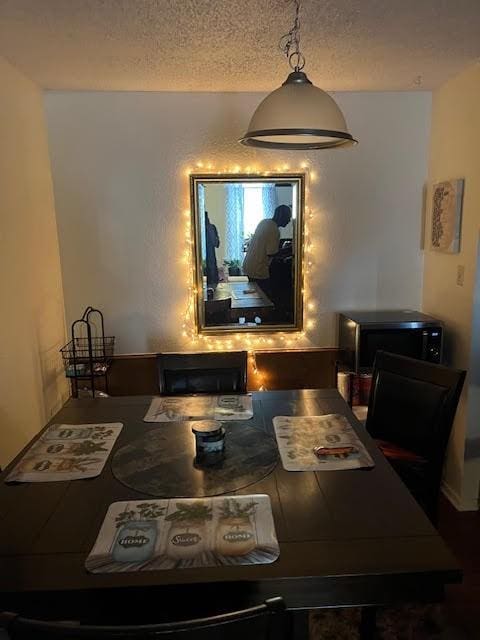 dining area with a textured ceiling