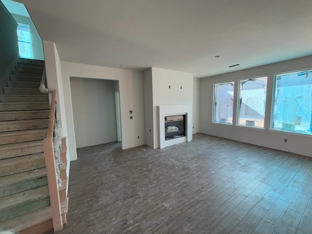 unfurnished living room with hardwood / wood-style floors