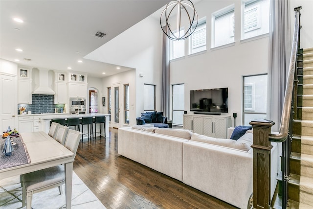 living room featuring a chandelier and hardwood / wood-style flooring