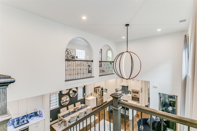 hall with hardwood / wood-style flooring