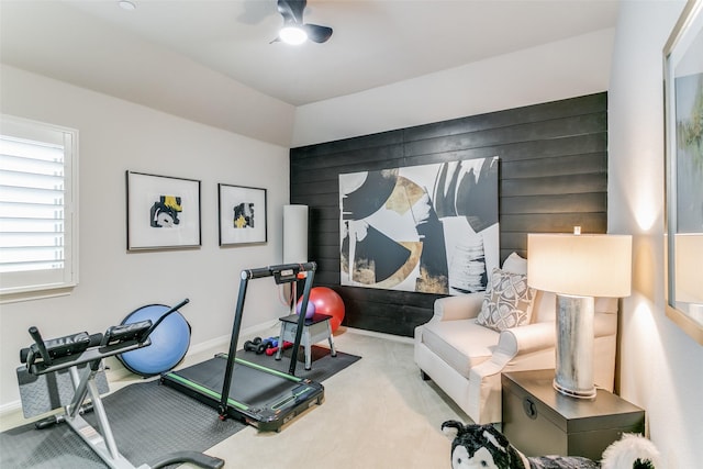 workout area with light carpet and ceiling fan