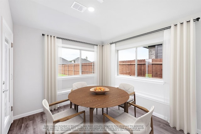 dining room with hardwood / wood-style flooring