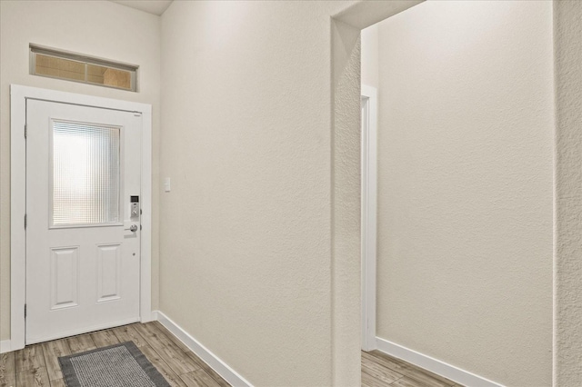 doorway with light hardwood / wood-style flooring