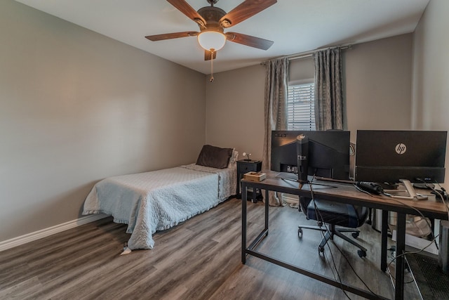 bedroom featuring ceiling fan and hardwood / wood-style flooring