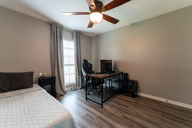 bedroom featuring ceiling fan and dark hardwood / wood-style flooring