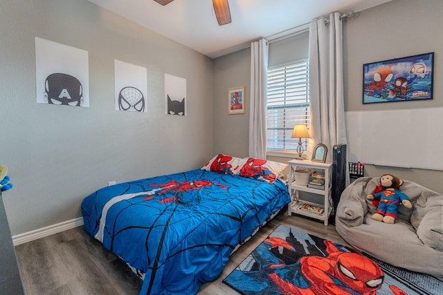 bedroom with ceiling fan and dark hardwood / wood-style flooring