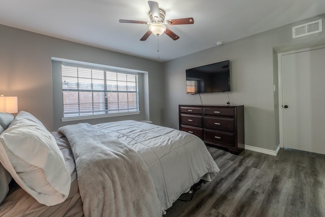 bedroom featuring dark hardwood / wood-style flooring and ceiling fan