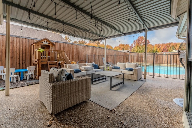 view of patio featuring an outdoor hangout area, a playground, and a fenced in pool