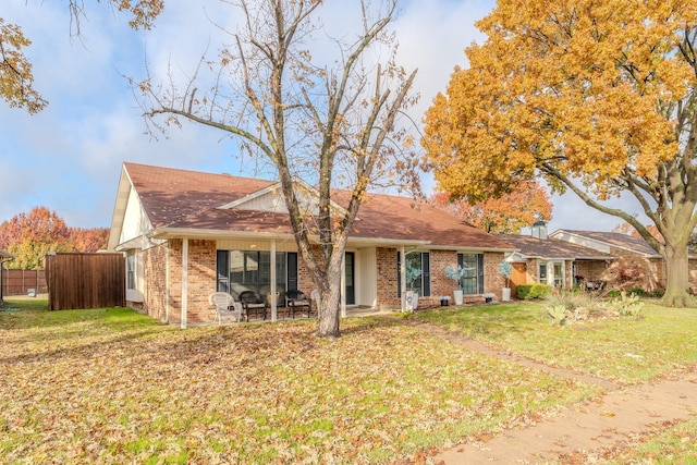 back of house featuring a patio and a yard