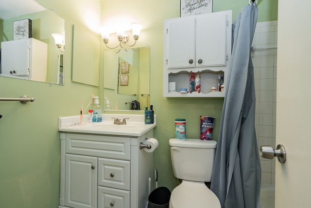 bathroom featuring vanity, a shower with shower curtain, and toilet