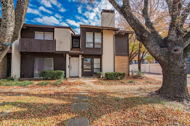 view of front of property with a balcony