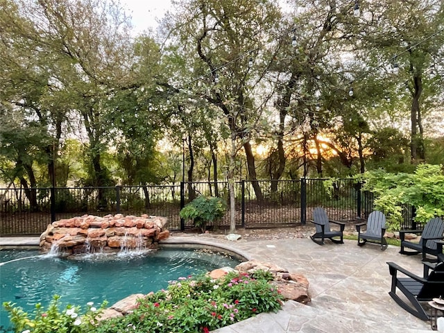 view of swimming pool featuring a patio and pool water feature